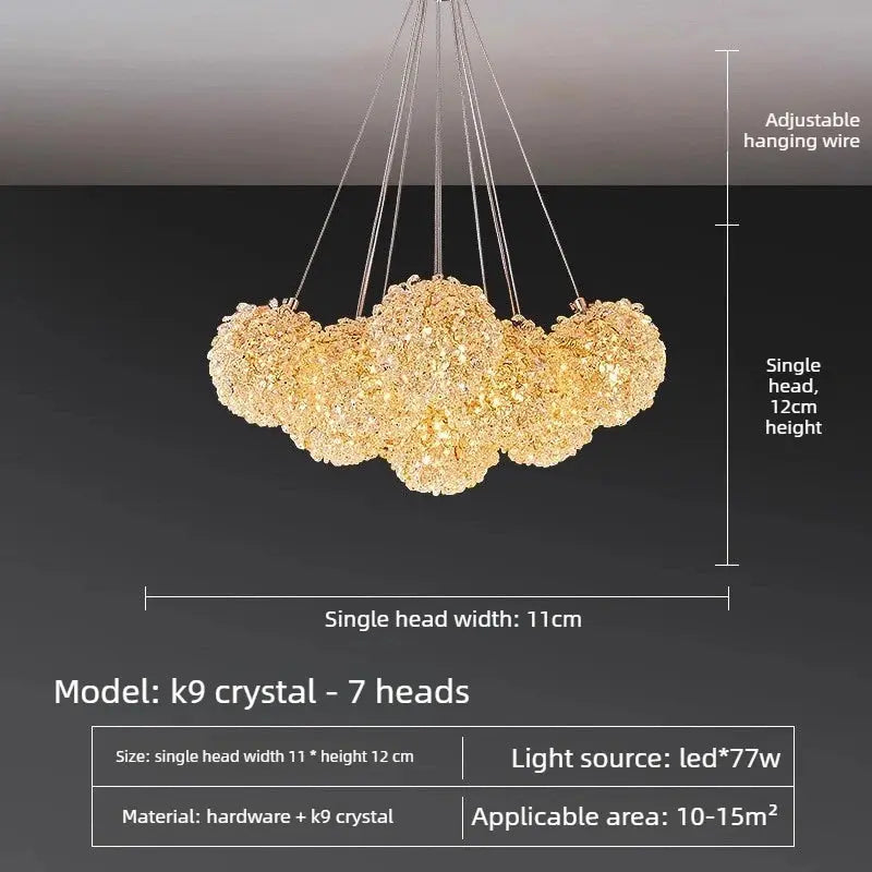A 7-head crystal pendant chandelier with adjustable hanging wires, shown against a dark background with dimension lines and text specifying single head width of 11cm, single head height of 12cm, and model k9 crystal.