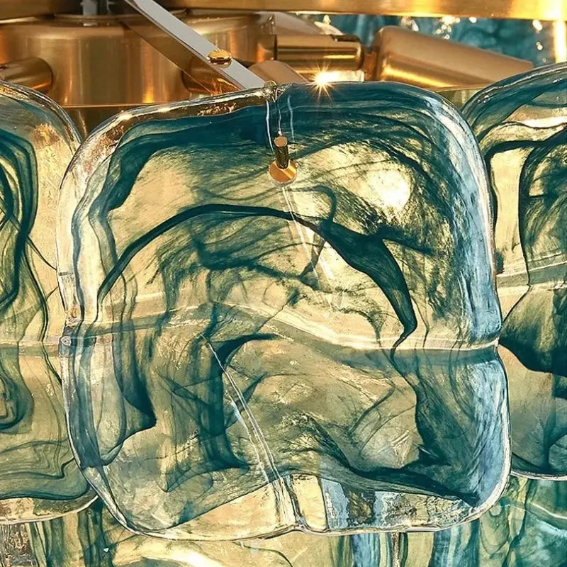 Glass sculpture with abstract design in a reflective surface